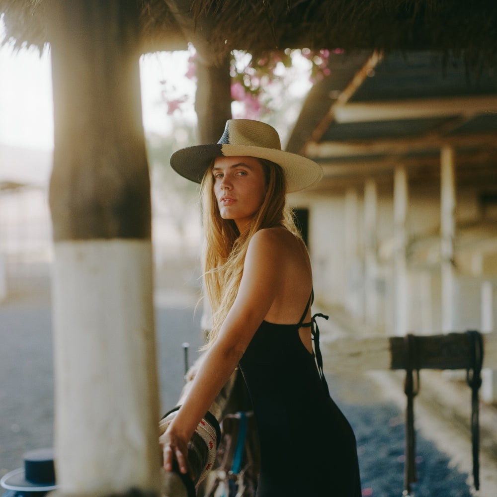 The Straw Iconic Limited Eclipse. Straw hat. Straw hat styles. Summer hat style. Summer hat. Summer hat styles. Black and white hat. Duo tone black and white hat. Duo-tone hat style. unique hat. statement hat. Unique Hat designs. Unique hat styles. Statement Hat. Statement hat Styles