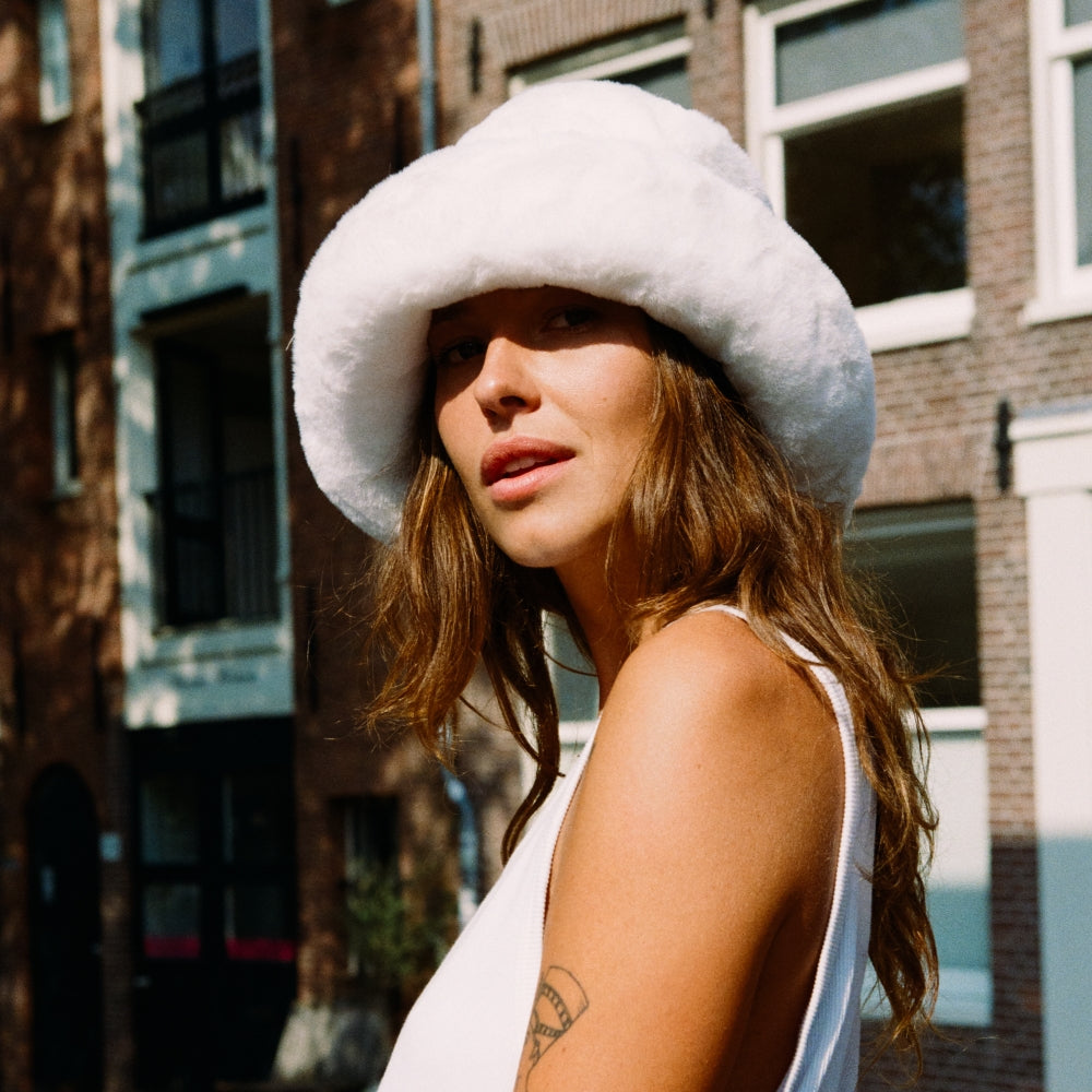 The Bucket Hat. Furry Bucket Hat. Faux Fur Bucket Hat. Fluffy Bucket Hat. Winter Bucket Hat. Brown Bucket Hat. Winter Bucket Hat. Winter Hat Styles. Fluffy Winter Hat Style. Winter Skiing hat styles.