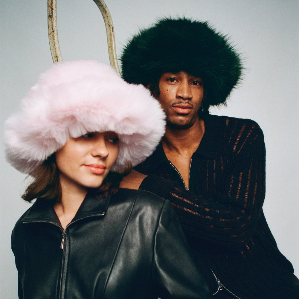 The Bucket Hat. Furry Bucket Hat. Faux Fur Bucket Hat. Fluffy Bucket Hat. Winter Bucket Hat. Brown Bucket Hat. Winter Bucket Hat. Winter Hat Styles. Fluffy Winter Hat Style. Winter Skiing hat styles. Pink Bucket hat. Pink fun furry hat. Pink Fur Hat. Winter Hat Style. Winter Hat Trends