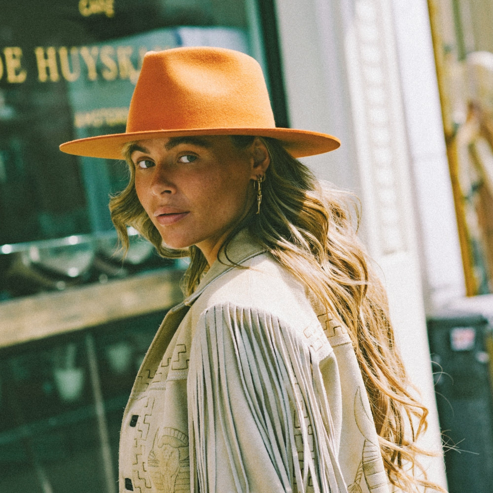 The Iconic Terra Cotta orange Fedora Hat. Timeless Fedora Hat. Statement Fedora hat. Unique Hat styles. Unieke Hoed. Statement hoed. Trendy hoed. High quality hats. Hoed Amsterdam. Hoedenwinkel in Amsterdam.