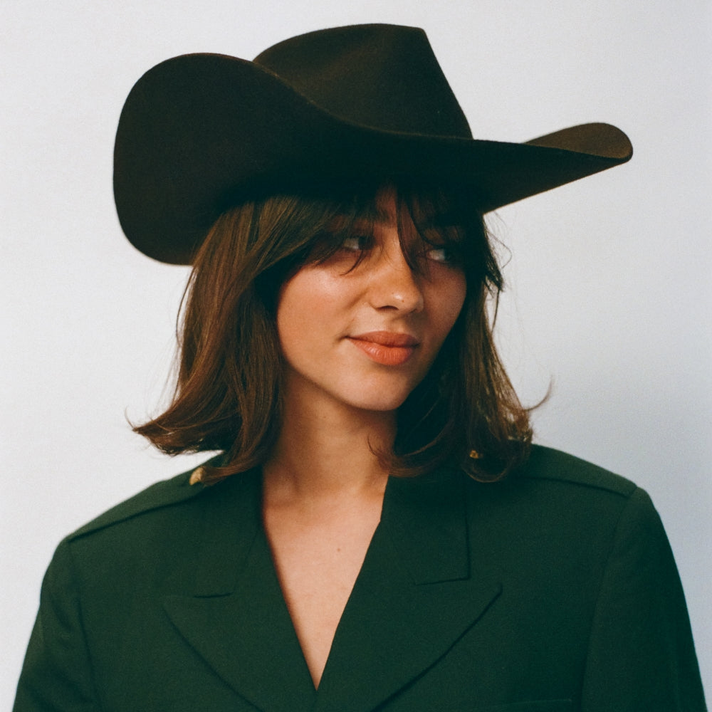 The Rodeo Smokey Brown Cowboy Hat is a fedora hat with western vibes. Channel your inner cowboy with this traditional cowboy hat. The Cowboy Hat is the perfect hat to wear to channel western vibes. The Rodeo Collection is perfect to channel your western vibes at a music festival in the warm sunshine.