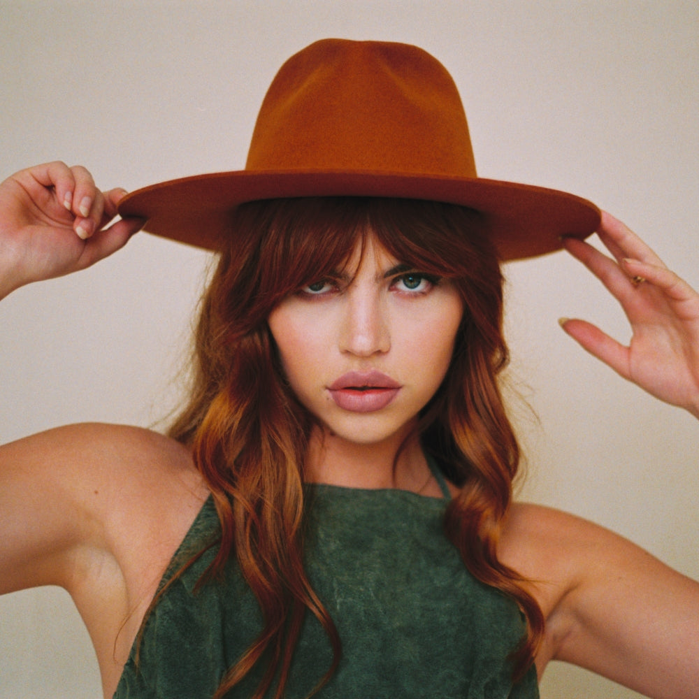 The Iconic Terra Cotta orange Fedora Hat. Timeless Fedora Hat. Statement Fedora hat. Unique Hat styles. Unieke Hoed. Statement hoed. Trendy hoed. High quality hats. Hoed Amsterdam. Hoedenwinkel in Amsterdam.