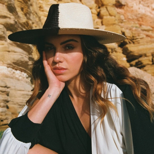 The Straw Iconic Limited Eclipse. Straw hat. Straw hat styles. Summer hat style. Summer hat. Summer hat styles. Black and white hat. Duo tone black and white hat. Duo-tone hat style. unique hat. statement hat. Unique Hat designs. Unique hat styles. Statement Hat. Statement hat Styles